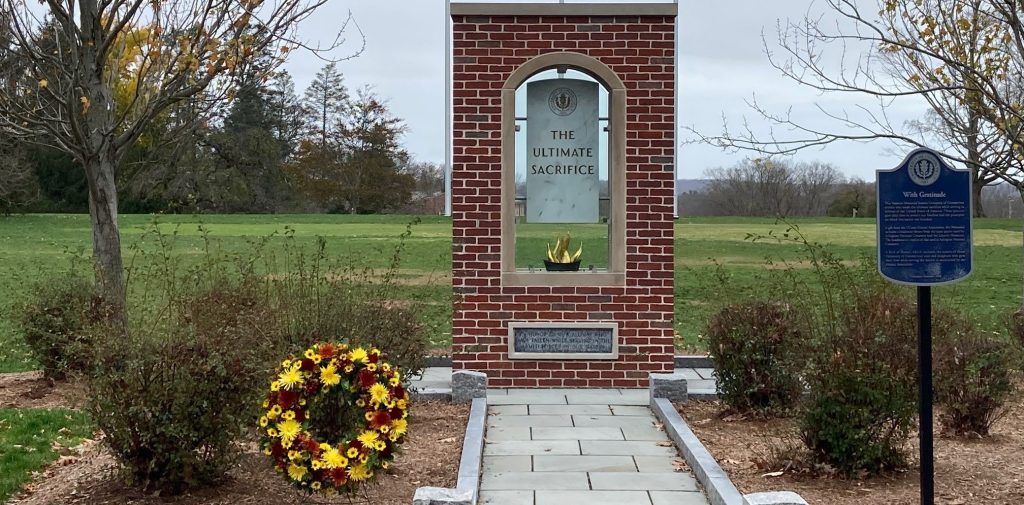 Ultimate Sacrifice Memorial on the UConn Campus (Storrs) with wreath placed in front.